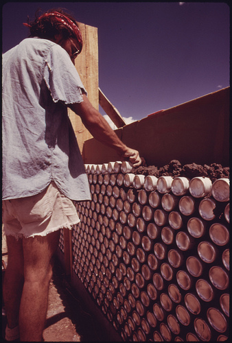 Construction of One of Three Experimental Houses Built from Empty Beer and Soft Drink Cans.