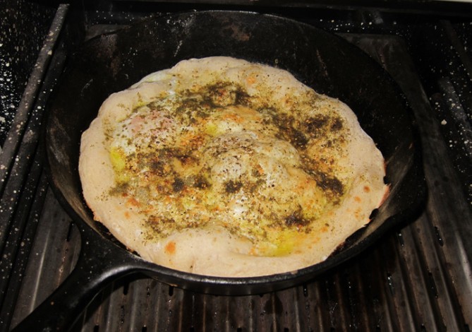 Breakfast pizza with eggs and zaatar.