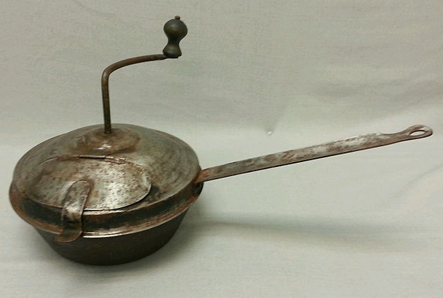 A hand-cranked wood stove top coffee roaster circa 1890-1910. Image: Wikipedia.